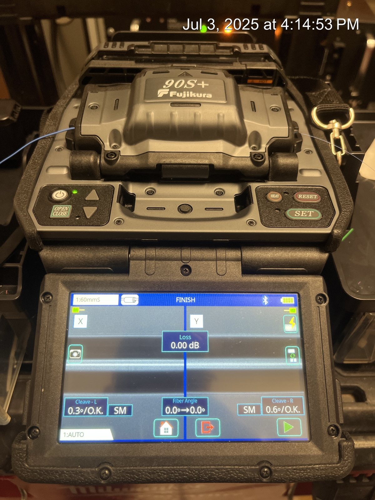 Fujikura fusion splicer showing completed fiber splice loss