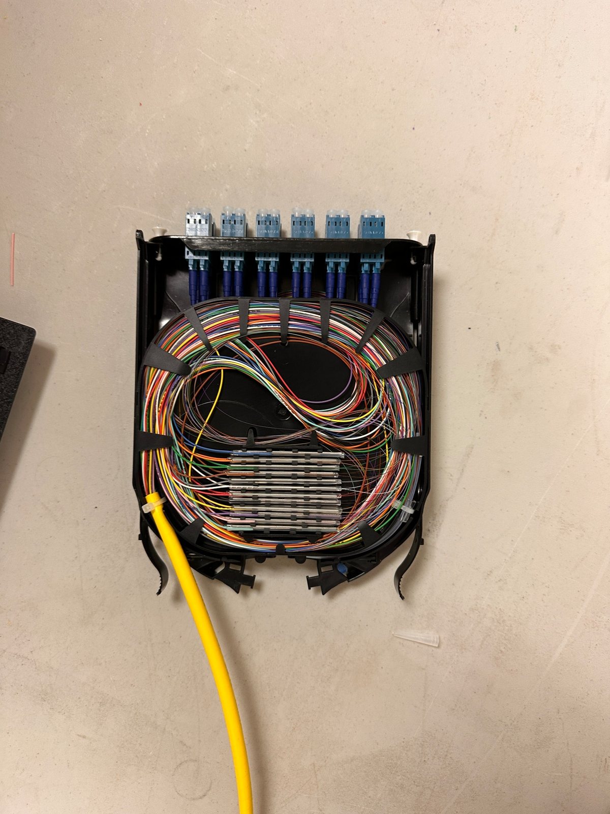 Fiber enclosure with organized splice tray and LC connectors