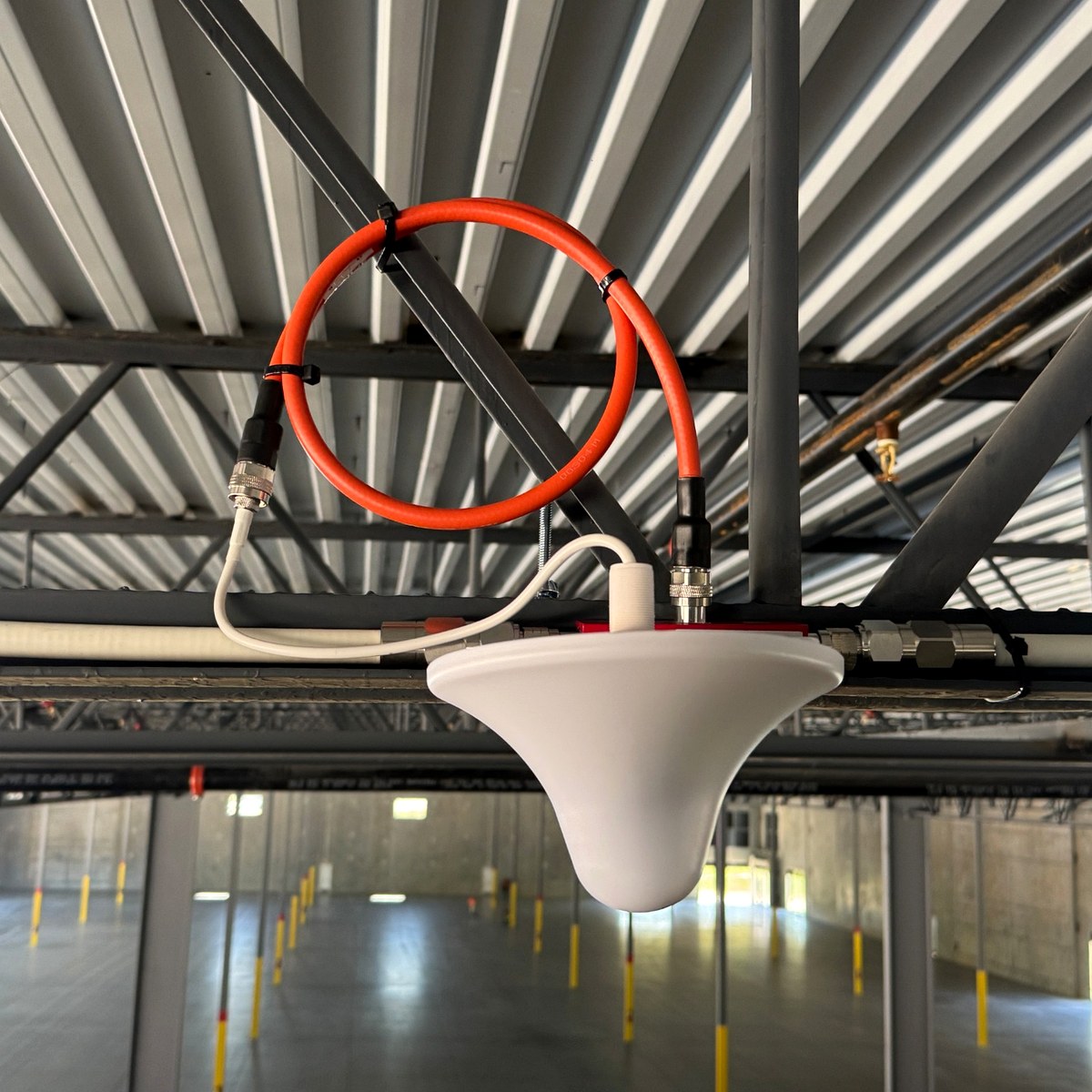 Warehouse service antenna and coax jumper for public safety DAS