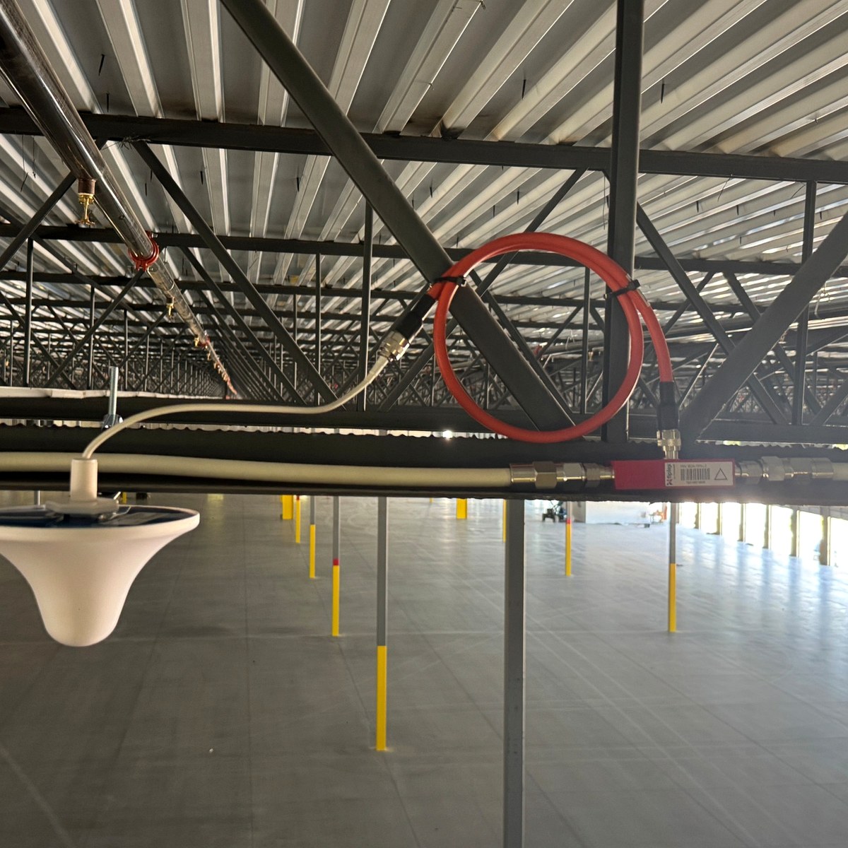Public safety DAS service antenna over warehouse dock area
